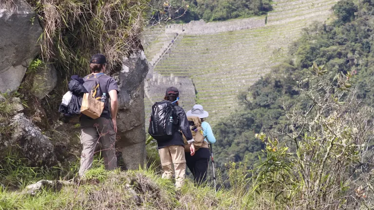 Panoramic view of the Inca Trail with tourists walking