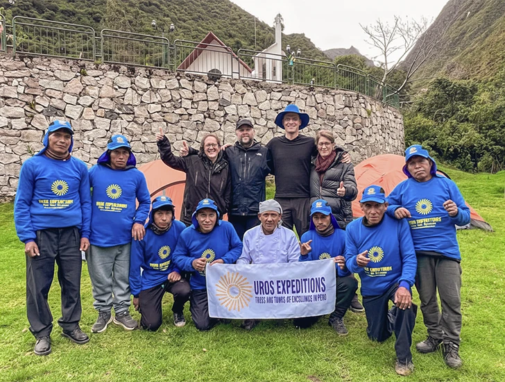 Team of porters on the Inca Trail 4 Days 3 Nights carrying supplies and supporting trekkers on the route to Machu Picchu, representing hard work and Andean tradition in Cusco, Peru