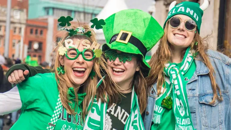 People dressed in green celebrating St. Patrick’s Day at a parade